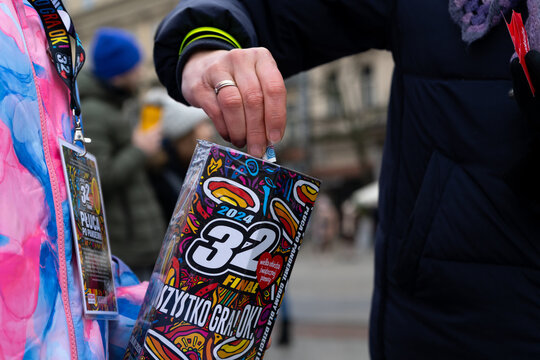 Great Orchestra of Christmas Charity Aid volunteer, with collection box to collect money during Grand Finale fundraiser. Wielka Orkiestra Świątecznej Pomocy WOŚP on January 28, 2024 in Krakow, Poland.