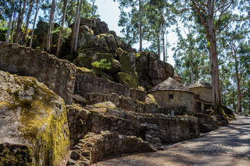 Stone wall in the shade with moss from ancient Roman fortification with stone hill in Castro of St Lawrence, Vila Chã - Esposende PORTUGAL