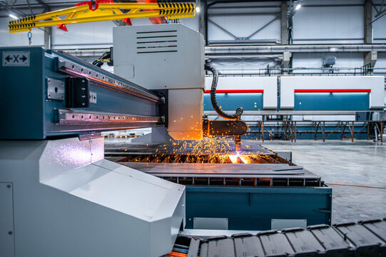 The fiber laser cutting machine cutting machine cut the metal plate. The hi-technology sheet metal manufacturing process by laser cutting machine.
