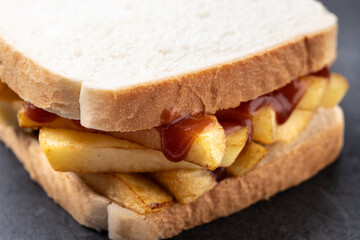 Sliced white bread on black slate background. Close up