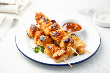 Homemade chicken skewers with mango chutney