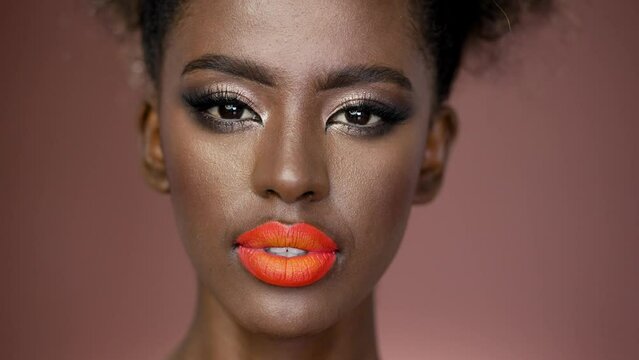 Sensual african american girl with colorful fashion makeup