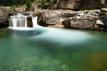 Fototapeta na wymiar Ara river waterfalls in the Soaso circus in the Ordesa Valley National Park in Aragon Pyrenees. Huesca, Spain.
