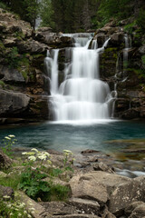 Fototapeta na wymiar Gradas de Soaso (Soaso waterfalls) in the Ordesa Valley National Park in Aragon Pyrenees. Huesca, Spain. Ara river waterfalls.