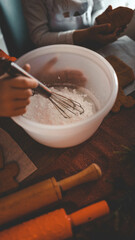 Children decorate gingerbread house, cozy homely Christmas atmosphere