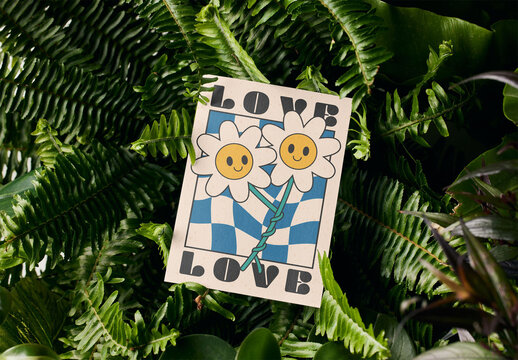 Mockup of customizable vertical A6 postcard in ferns