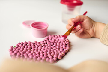 Child doing creativity, gift for Mother's Day or Valentine's Day