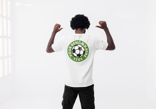 Mockup of man wearing customizable t-shirt, rear view