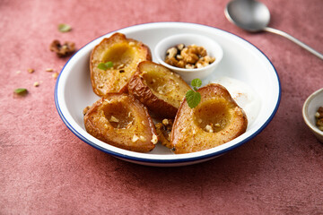 Roasted pears with walnut and yogurt