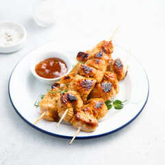 Homemade chicken skewers with mango chutney