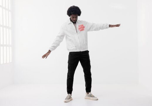 Mockup of man wearing customizable jacket, arms out