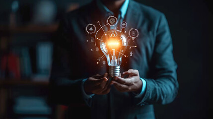 Businessman holding glowing lightbulb with learning icons for study knowledge to creative thinking idea and problem solving solution concept