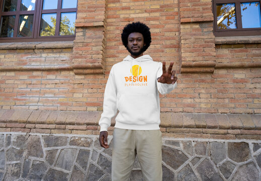 Mockup of man wearing customizable hoodie, peace sign