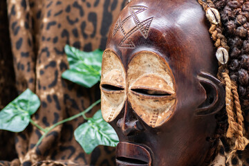 Wooden tribal African mask from Uganda, for family or personal protection, made of local wood,...