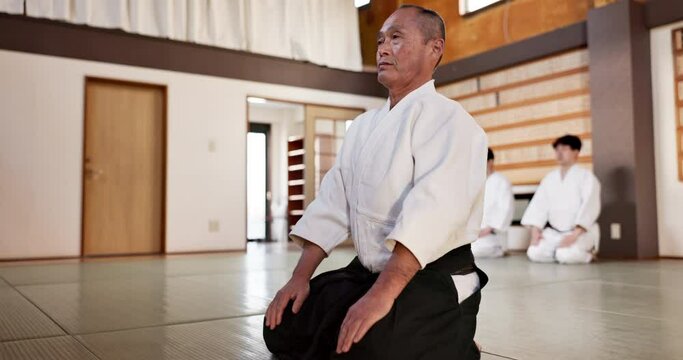 Martial arts students, sensei or bow in dojo for aikido practice, discipline or self defense in class. Respect, floor or Japanese master teaching combat or training workout for fighting or education