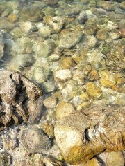 stones in ocean crystal clear ocean water