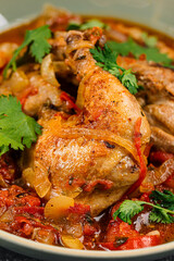 Portion of stewed chicken with vegetables