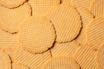 Fototapeta premium Fresh homemade baked thin cheese waffles full frame close up as background