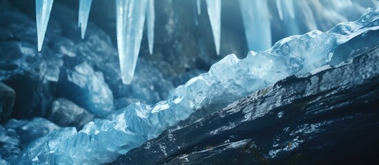 Frozen waterfall of blue icicles on the rock. Creative Banner. Copyspace image