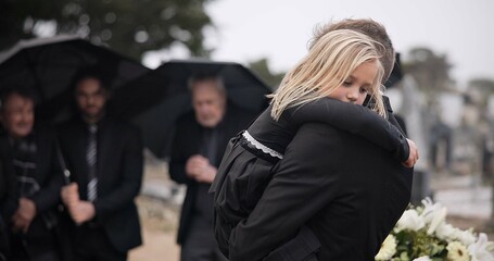 Sad, hug and a father and child at a funeral with depression and mourning at the graveyard....