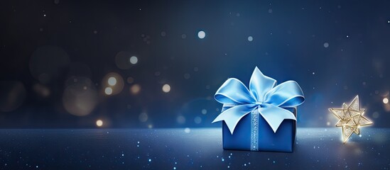 Happy Hanukkah greeting on blue holiday gift tag with a dreidel on glitter paper with a ribbon. Creative Banner. Copyspace image