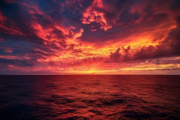 Tuinposter Apocalyptic fiery sky over ocean horizon at dusk © Amer