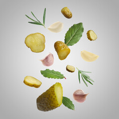 Tasty pickled cucumbers, garlic, rosemary and bay leaves falling on light grey background