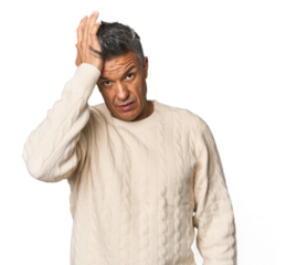 Middle-aged Latino man tired and very sleepy keeping hand on head.