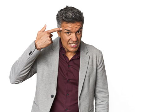 Middle-aged Latino man showing a disappointment gesture with forefinger.