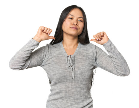 Young chinese woman isolated feels proud and self confident, example to follow.
