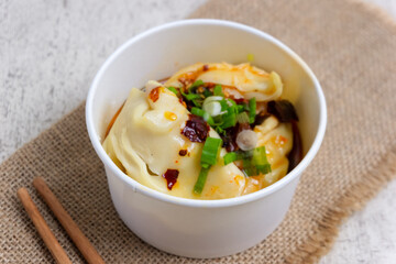 Chili Oil Wontons are a Chinese dumpling dish often served in soup or fried. Wonton filling usually consists of a mixture of minced meat (such as chicken or shrimp) and spices.