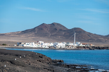 Fototapeta premium Punta de Jandia and lighthouse on southern end of Fuerteventura island, accessible only by gravel road