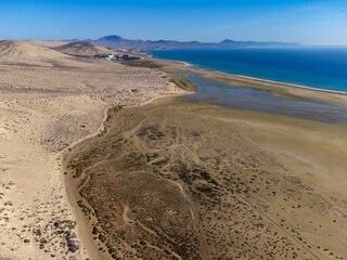 Aerial view on sandy dunes and turquoise water of Sotavento beach, Costa Calma, Fuerteventura, Canary islands, Spain in winter