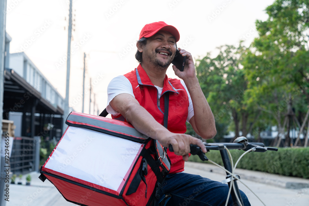 Wall mural Food delivery personnel calling a customer