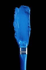 Blue paintbrush against a black background. Suitable for artistic projects or creative concepts