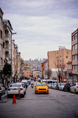 Fototapeta na wymiar Taxi rides in a residential part of Fatih district in Istanbul, Turkey.