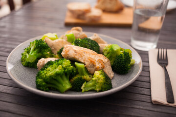Chicken breast with broccoli on plate for healthy breakfast