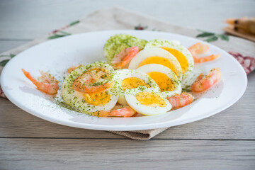 boiled eggs with boiled shrimp in a plate for breakfast