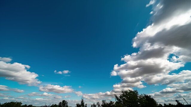 flying White Clouds on the summer sky Time laps