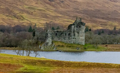 Kilchurn castle with loch and mountains 