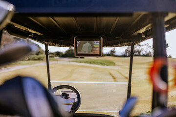 Sotogrande, Spain - January, 23, 2024 - This is a view from the driver's seat of a golf cart,...