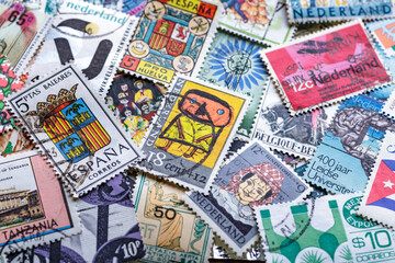 Ukraine, Kiyiv - January 12, 2023.Postage stamps.A collection of world stamps in a pile.Postage stamps from different countries and times