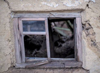Wooden window of damaged building