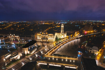 Luminous Tapestry: Captivating Aerial View of Oradeas Enchanting Night Cityscape