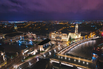 Midnight Symphony: A Captivating Aerial Glimpse of Oradea, Romanias Vibrant Cityscape Illuminated by Night
