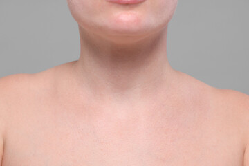 Closeup view of woman with normal skin on grey background