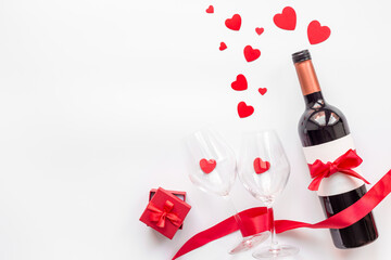 Fototapeta na wymiar Bottle of red wine for Valentines Day celebration, top view