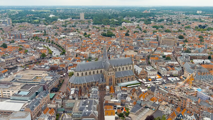 Haarlem, Netherlands. The Church of St. Bavo is a Gothic temple. Panoramic view of Haarlem city center. Cloudy weather during the day. Summer, Aerial View
