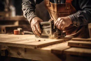 Foto op Plexiglas Oud vliegtuig Carpenter doing wood work using classic old machine plane.