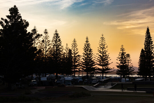 Late afternoon view of Port Macquarie skate park with caravan park in background